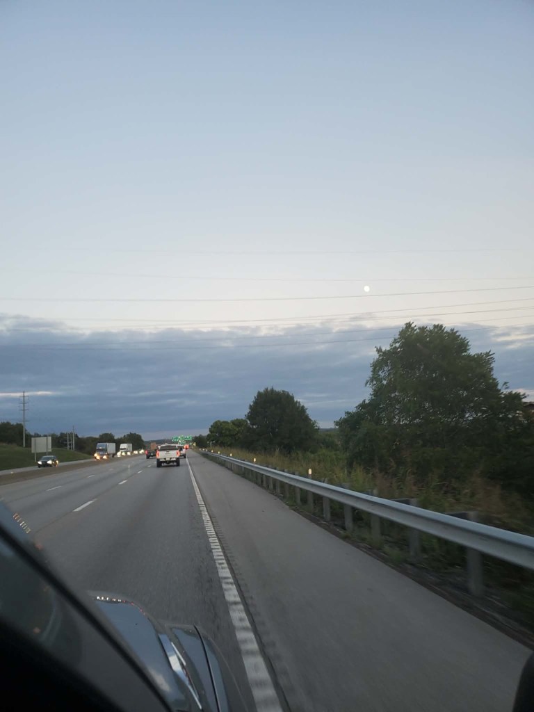 Evening sky and Moon over a Kansas City roadway, photographed by Kyle