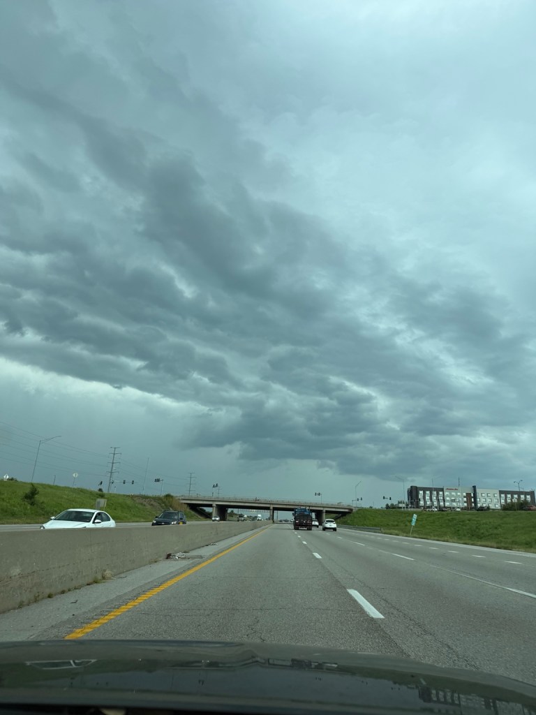 Layered turbulent storm clouds over the highway in Kansas City at 2:48 PM on September 9, 2026.