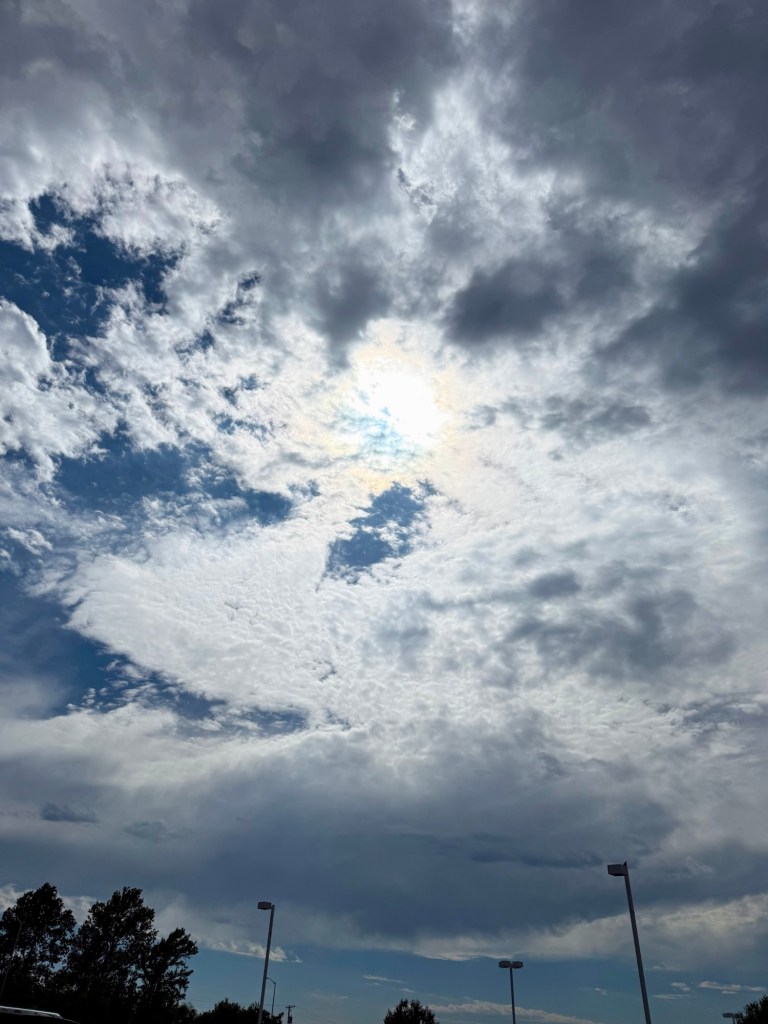 Cloud boundary and blue sky at 3:27 PM