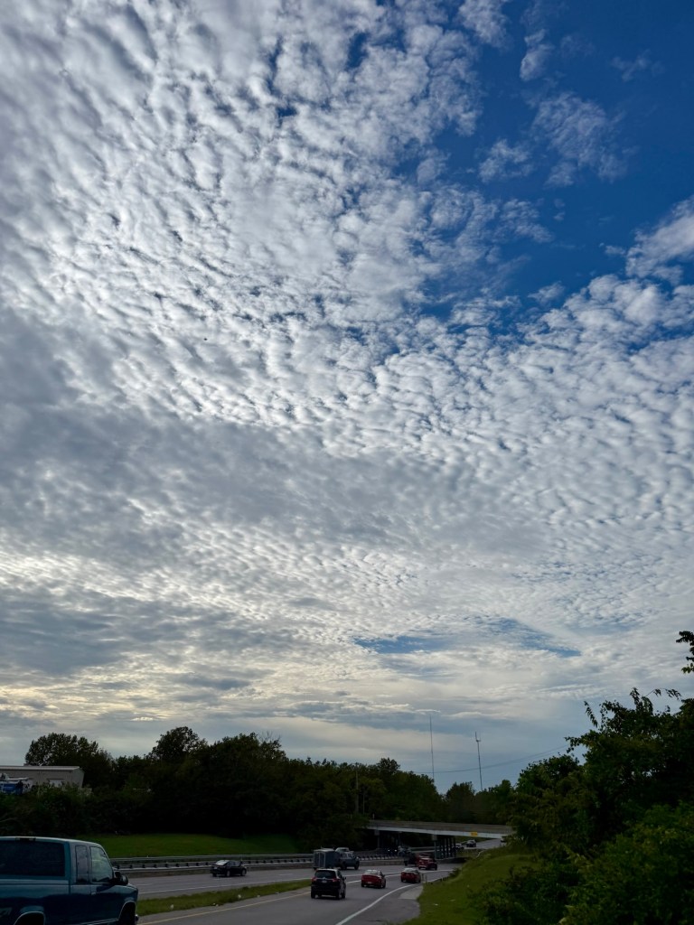 A broad textured cloud field stretching over a roadway in Raytown at 5:25 PM.