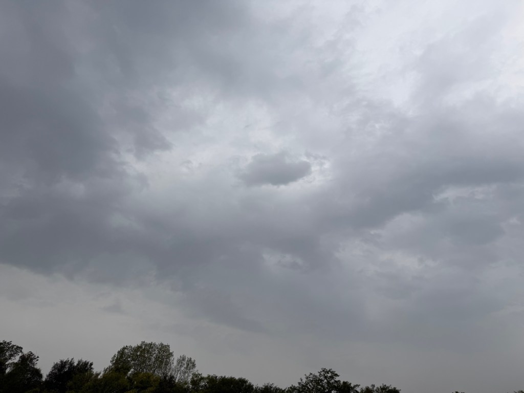Dark gray rain-bearing clouds over Independence, Missouri during light rain