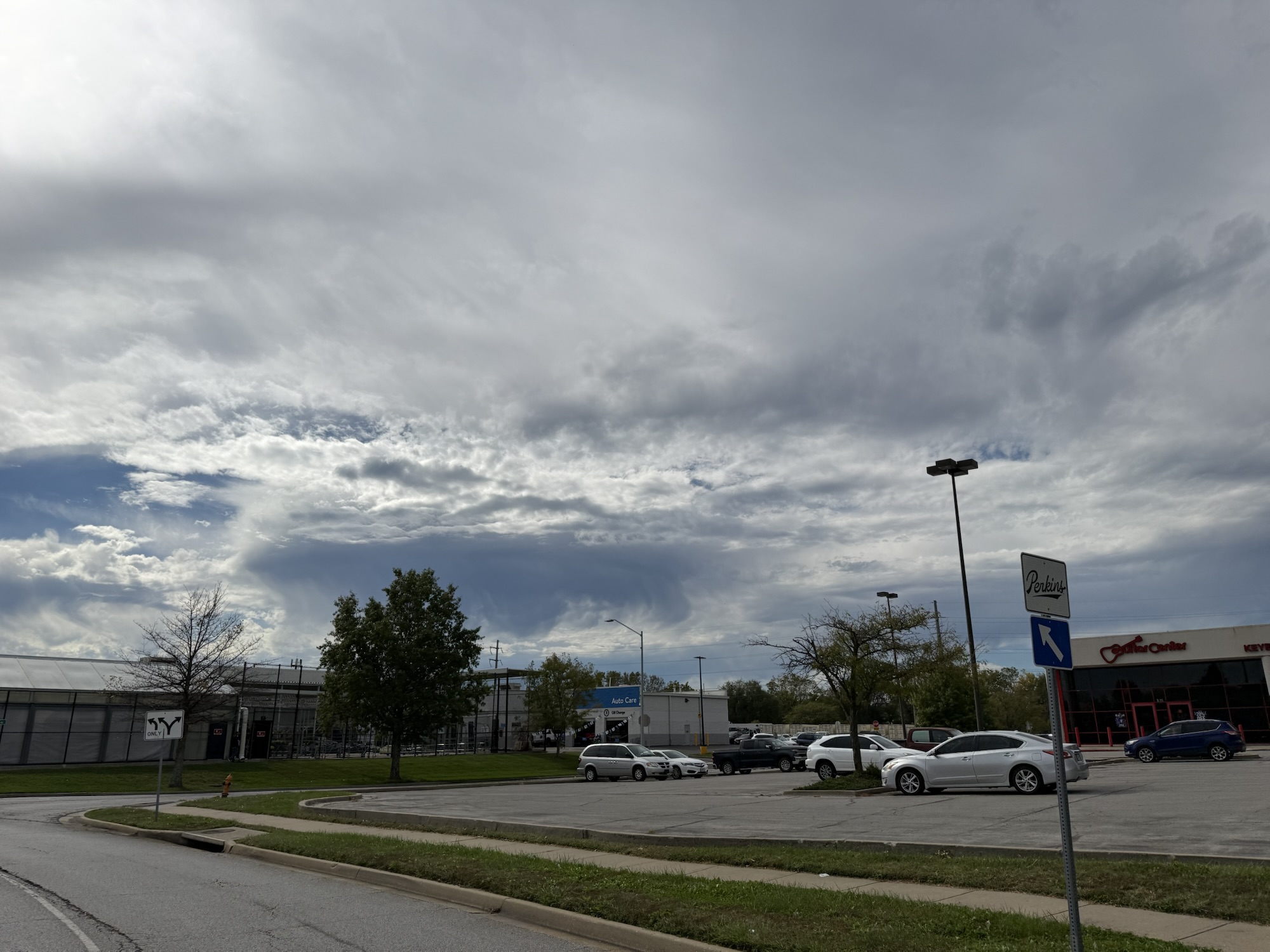 1:15 PM, Independence: a darker cloud with possible streaks beneath it.